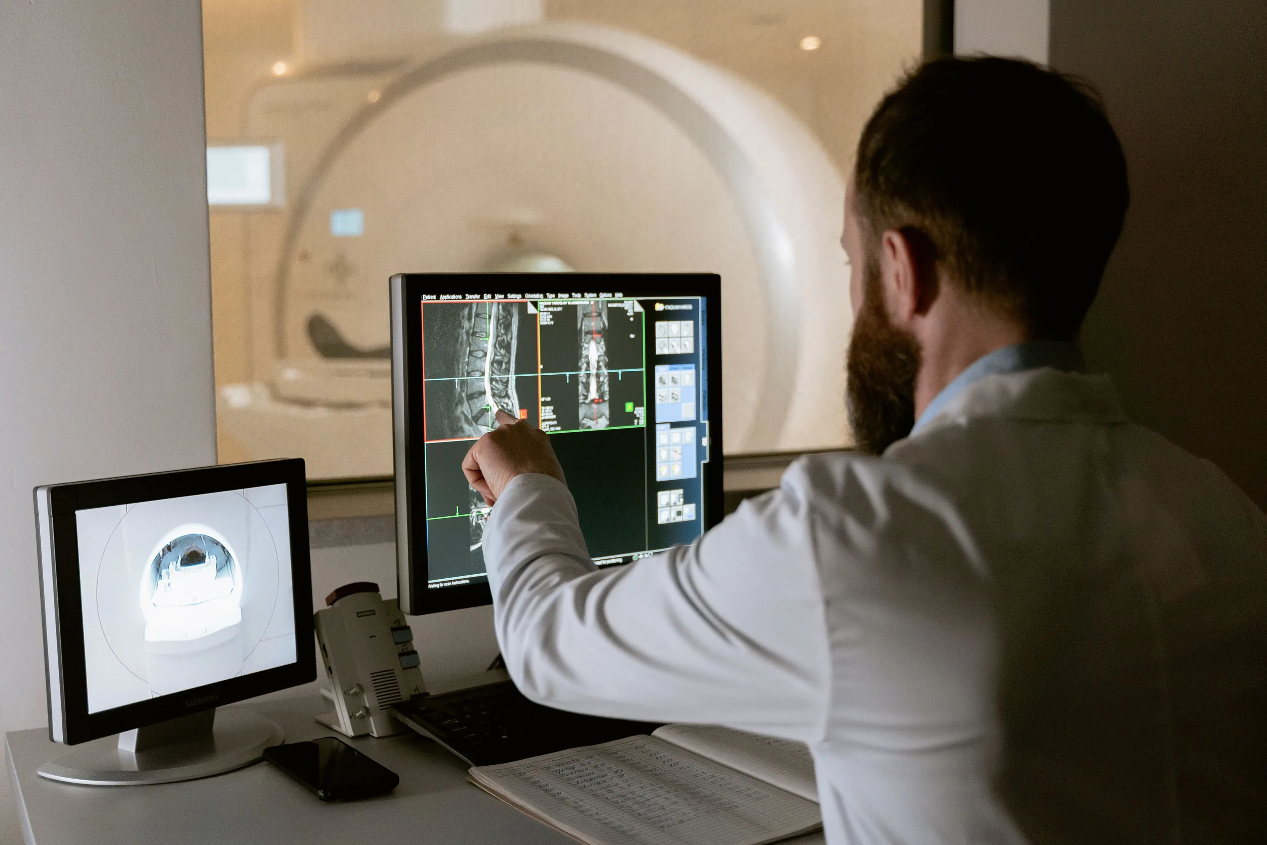 Radiologist reviewing a spine study on a reading workstation