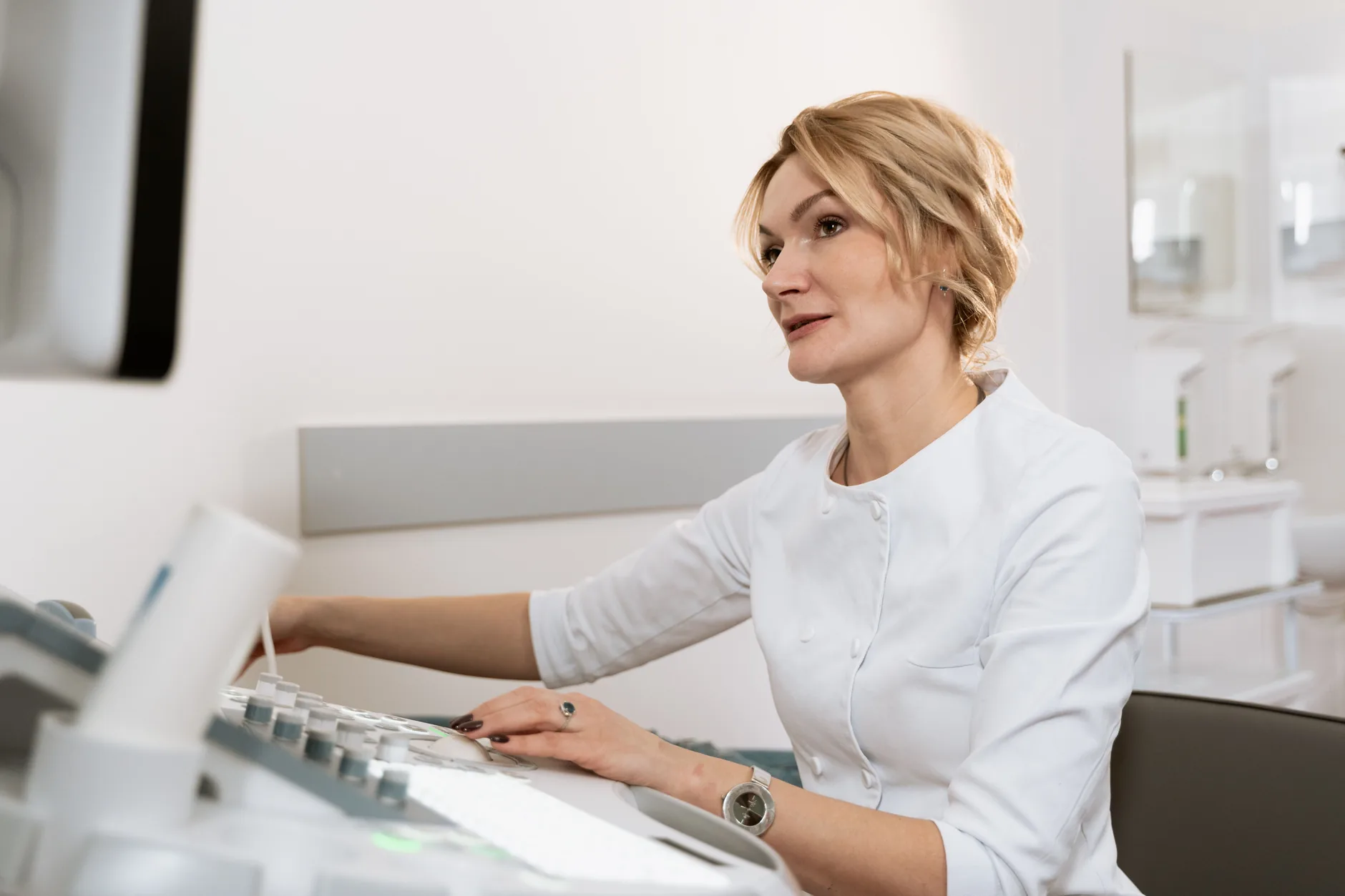 Sonographer operating an ultrasound console